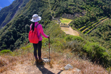 A trekker on a mountain trail in the Andes, showcasing the rugged terrain typical of the Choquequirao Trek.